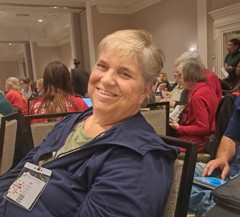 A UUP Oneonta delegate smiles warmly for the camera.
