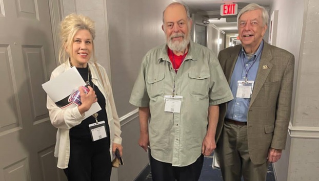 UUP Oneonta President Shirley Clark stands smiling with two other UUP Oneonta delegates